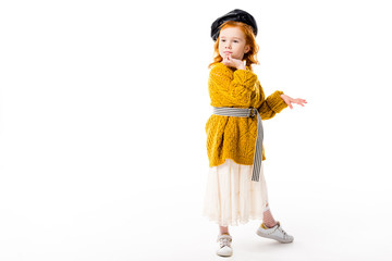 red hair child posing on white