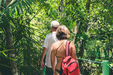 Tourists on a eco tour walking through a trail on the forest. Trail surrounded by nature on Bonito...