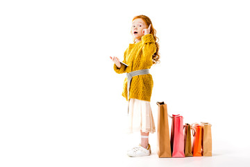 red hair kid showing idea gesture on white