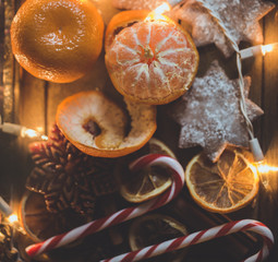 Christmas background with lights, ornaments, candy and decorations. Free space