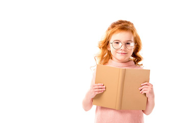 red hair kid standing with open book isolated on white