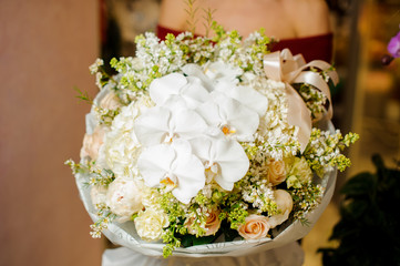 Woman holding a gorgeous bouquet of flowers