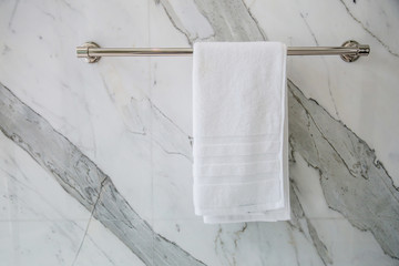 towel napkin on stainless stell rack in restroom