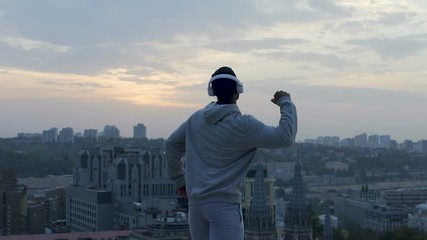 Active man feeling strength and freedom in his body, winner in life, inspiration