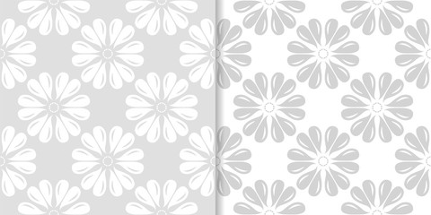 Light gray floral ornamental designs. Set of seamless patterns