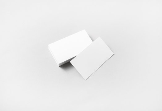 Photo of blank business cards on paper background. Template for branding identity.