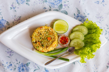 Curry Fried Rice, Stir-fried with egg, onions, green peas, carrots and seasoned with curry powder.
