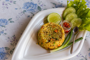 Curry Fried Rice, Stir-fried with egg, onions, green peas, carrots and seasoned with curry powder.
