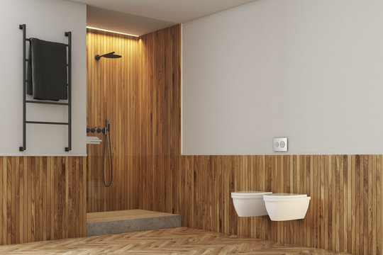 White and wooden bathroom, toilets and shower
