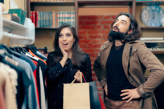 Couple Shopping for Clothes in Fashion Store 