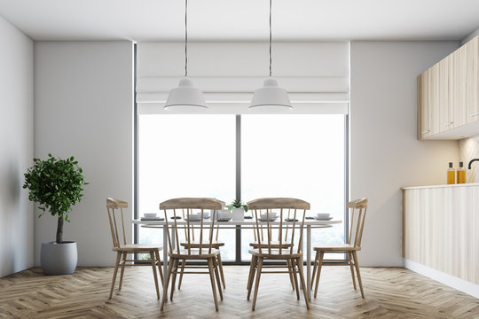 White dining room, wooden chairs