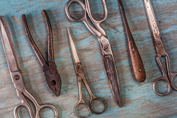 Collection of vintage tools on a blue wooden background