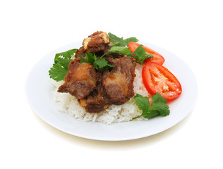 Grilled beef rib and rice in plate on white