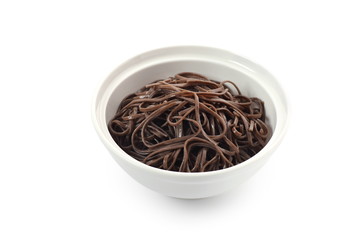 Buckwheat noodles on white background