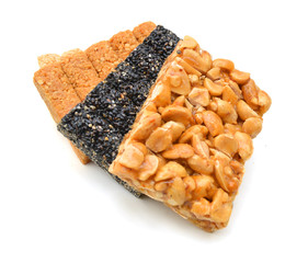 Honey bars with peanuts, sesame and sunflower seeds isolated