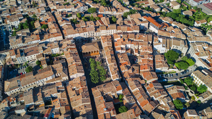 Aerial top view of residential area houses roofs and streets from above, old medieval town background, France
