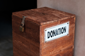 A box for donations in temple. Concept of positive social communication