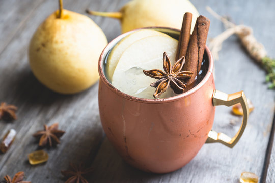 Cold Moscow Mule cocktail in copper mug on the rustic background. Shallow depth of field.