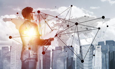 Concept of business success and control with confident boss against cityscape background