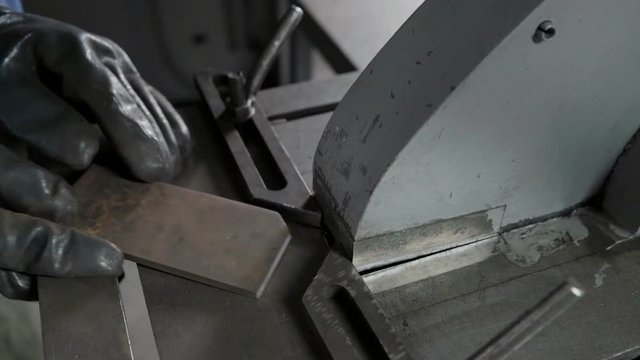 Production process cutting angle on metal piece on modern metalworking lathe