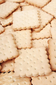 Biscuit sweet cookie craker background. Domestic stacked butter biscuit pattern concept. Biscuits texture close up macro. Food photo studio photography. Food photos.