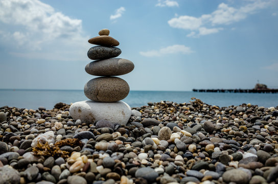 Pyramid of stones on the beach of the Black Sea.