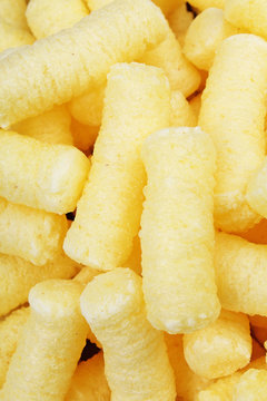 Cheese puff. Cheese puffs snack background texture food pattern. Food photo.