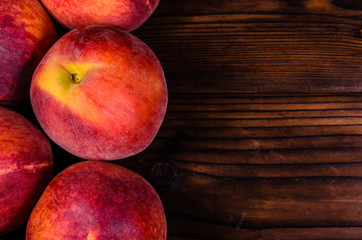 Fresh ripe peaches on wooden table. Top view