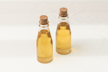 Oil in glass bottle with cork lid