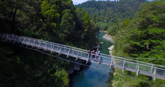 NEW ZEALAND &ndash; MARCH 2016 : Aerial shot of people enjoying beautiful view from walking bridge on a sunny day