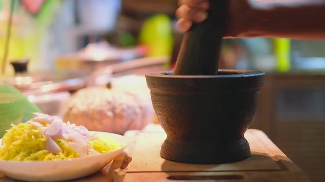 Pounding  granite mortar  and pestle  
