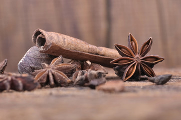  star of  anise and cinnamon  on wooden plank