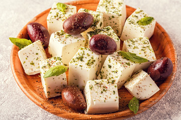 Greek cheese feta with oregano and olives.