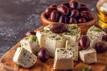 Greek cheese feta with oregano and olives.