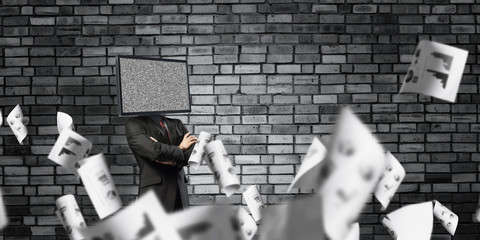 Businessman with TV instead of head.