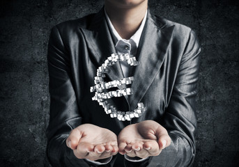 Businessman presenting euro symbol.