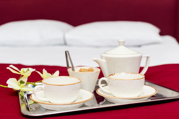 Breakfast in bed in hotel room