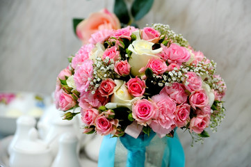 Wedding flower bouquet with pink and yellow roses