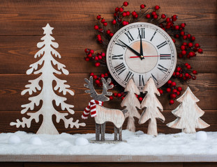 Christmas decorations: deer and firs on the snow