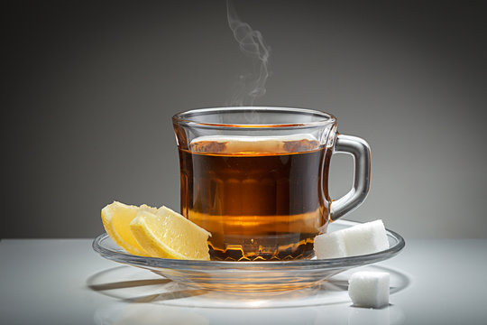 Hot tea, sugar, and lemon.