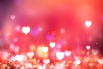 Glowing blurred hearts red background.Valentine's backdrop.