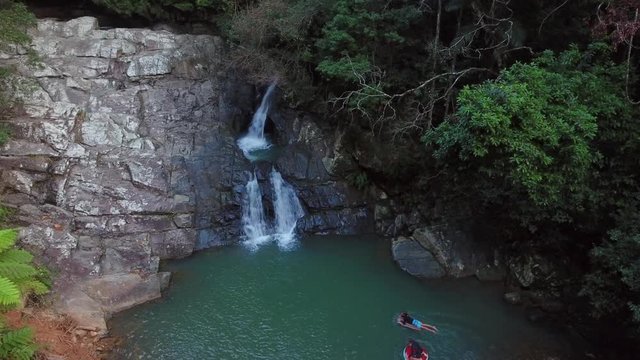 kids in rockpool at waterfall