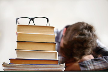 The student with glasses doing a homework. Study learning concept.