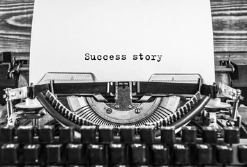Success story written on an old typewriter. close-up
