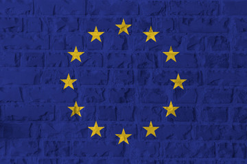 European Union flag on brick wall texture background.