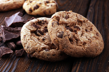 Chocolate cookies on wooden table. Chocolate chip cookies.