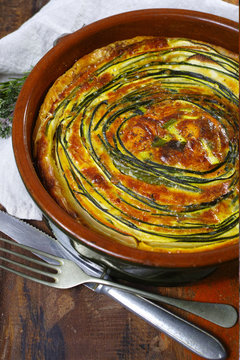 Homemade quiche vegetable pie with green courgette and carrot