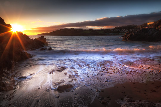 Sunset on the beautiful coastline of Rotherslade Bay, a small bay in South Gower next to the more famous Langland Bay.