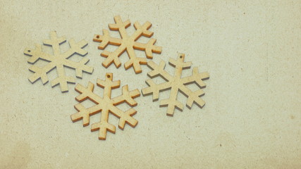 Wooden stars in retro style covered with sepia-colored texture. Image showing the festive atmosphere in the form of a Christmas card.