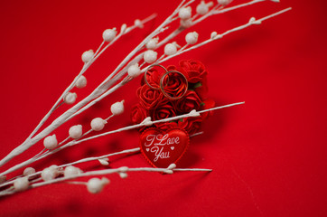 red flowers and wedding rings